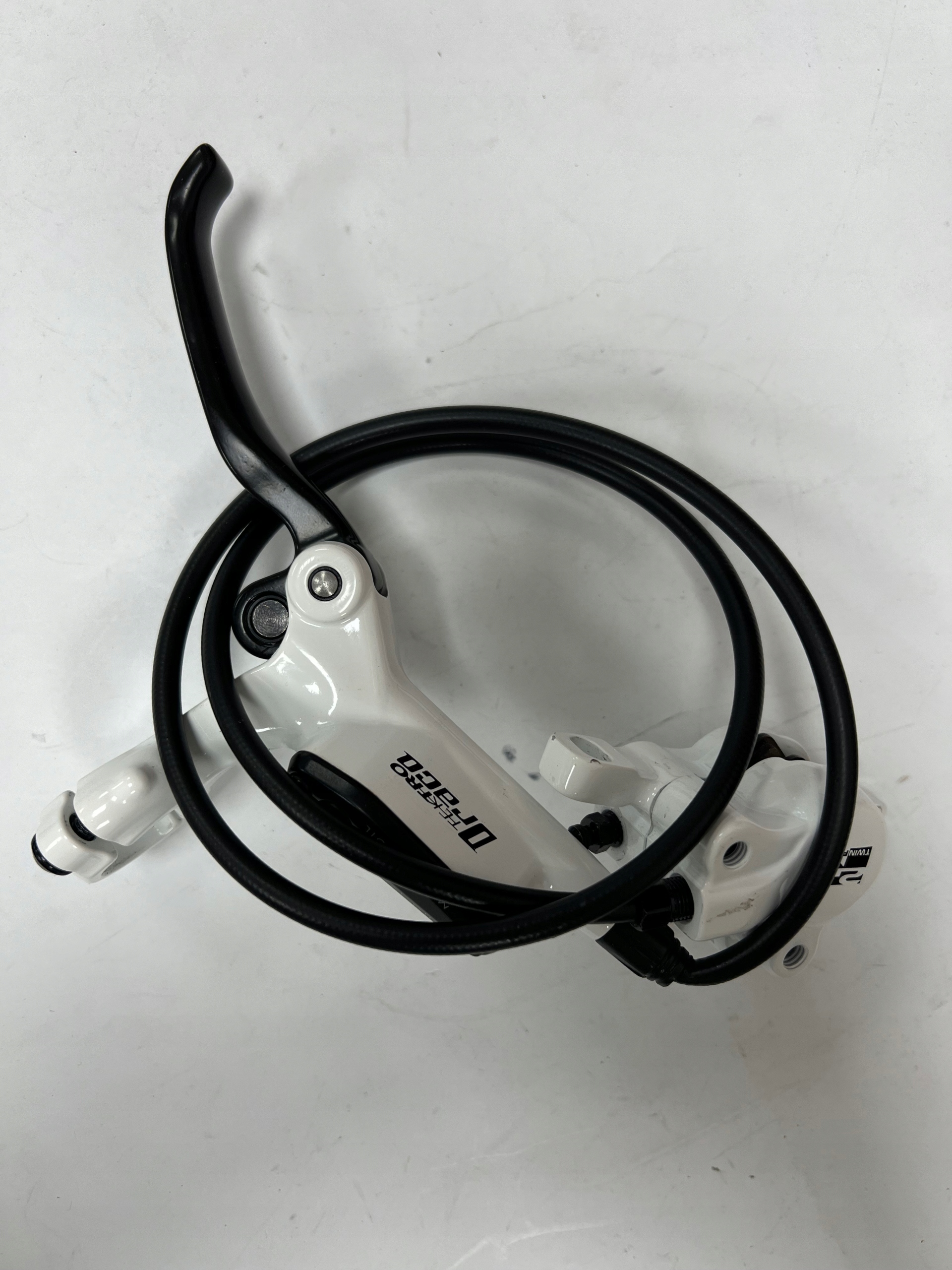 Hamulec hydrauliczny Tektro Draco Przód 67 cm, biały, 2 tłoczki - obrazek 4