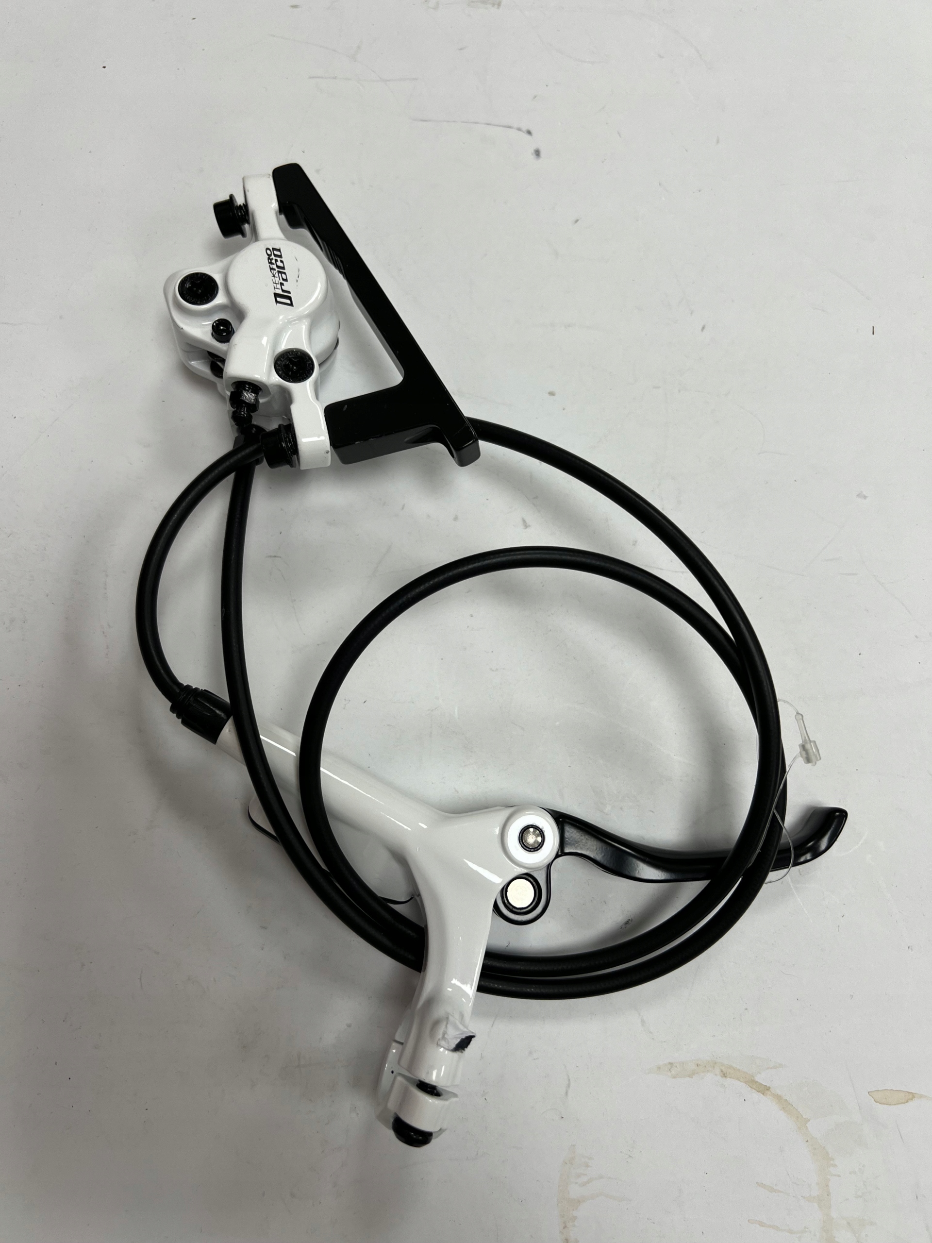 Hamulec hydrauliczny Tektro Draco Przód 72 cm, biały, 2 tłoczki + adapter - obrazek 2